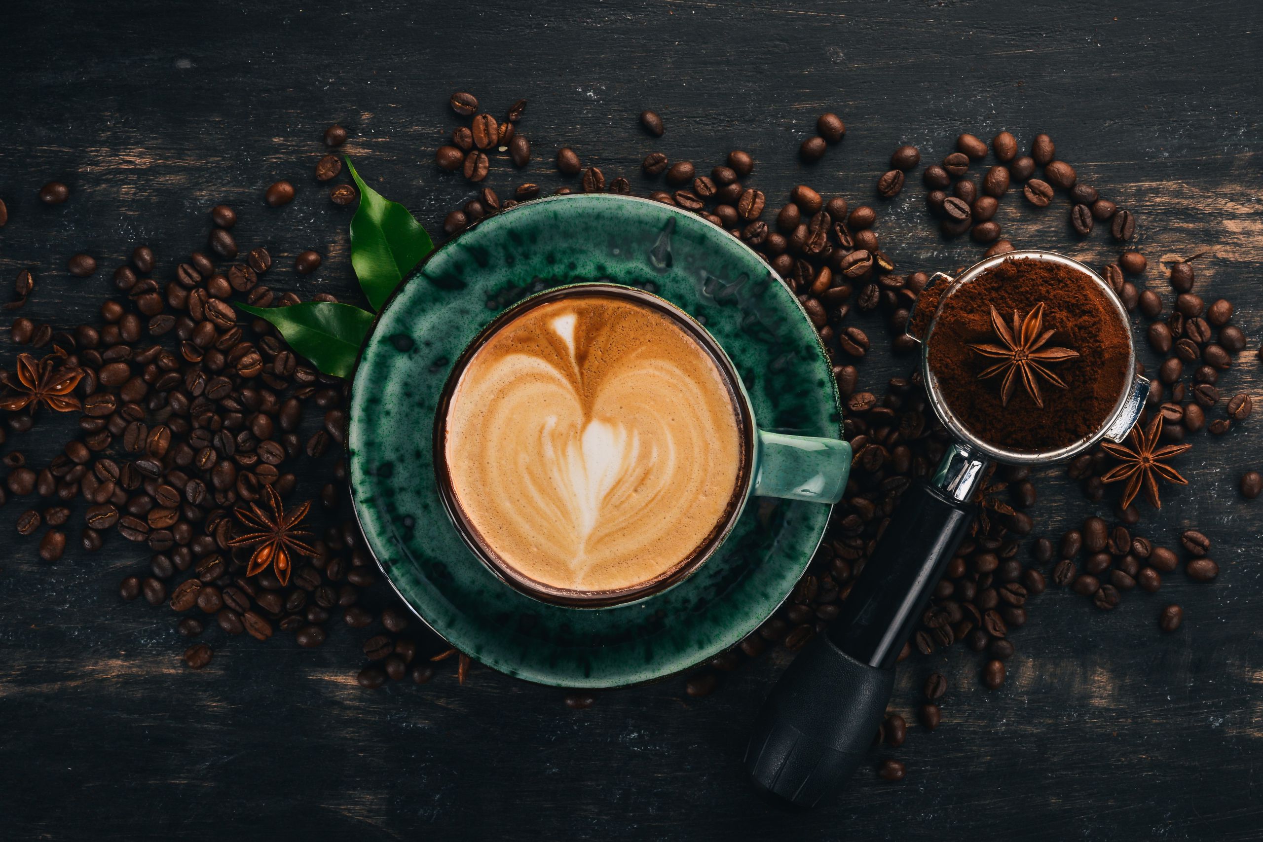 a-fragrant-cup-of-coffee-cappuccino-on-a-black-wooden-background-top-view-copy-space